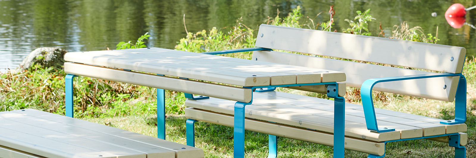 Wooden park table with benches, it has blue steel frames.